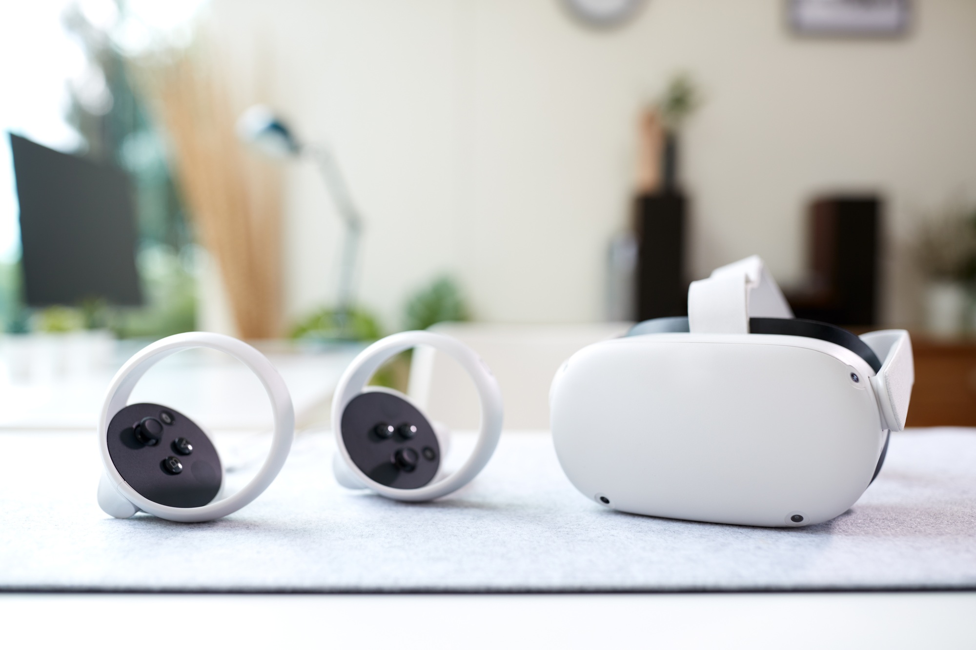 VR Headset And Gaming Controllers On Table At Home
